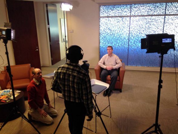 On set for a Mighty 8th shoot filming a client testimonial.